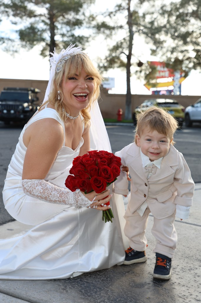 Bride with child in wedding attire